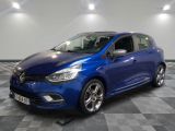 a blue car is parked on a checkered floor in a garage