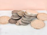 a pile of coins sitting on top of a table