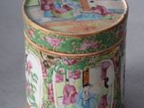 a green tin with a picture of a woman on it