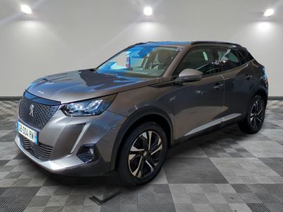 the grey suv is parked on a checkered floor in a garage