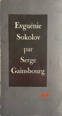 an old book with a black cover and white writing on it