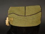 an image of a green hat with a tassel on it