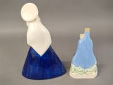 two salt and pepper shakers sitting next to each other
