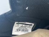 a close up of a person ' s foot with a shoe tag on it