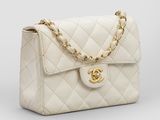 a chanel white quilted leather shoulder bag with gold hardware