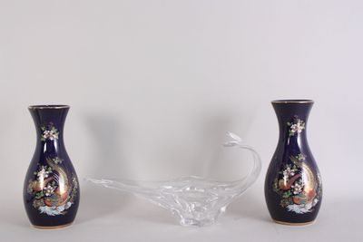 two vases sitting next to each other on a table
