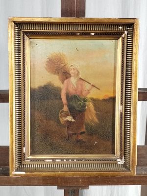 painting of a woman carrying a basket of wheat on a wooden easel