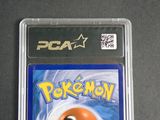 the card is in a clear plastic case with a yellow ball on top of it