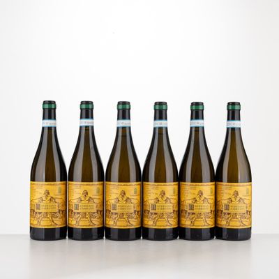 six bottles of wine lined up in a row on a table