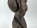sculpture of a woman ' s head with a large turban on it ' s head