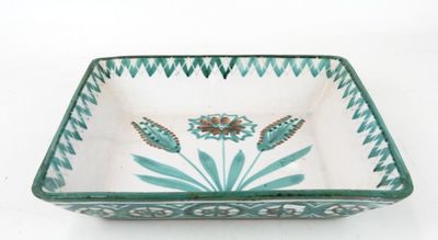an image of a green and white bowl with flowers on it