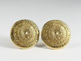 pair of gold plated cufflinks with a circular design