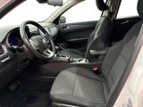 the interior of a car with a steering wheel and a dashboard