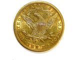 a close up of a gold coin with an eagle on it