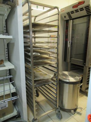 an image of a commercial kitchen with a rack full of food