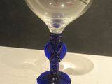 a wine glass that is sitting on a table