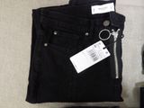 a pair of black pants with a tag on them