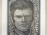 a black and white photo of a man ' s face in a picture frame
