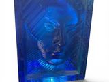 an image of a blue glass block with a face inside of it