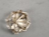 a close up of a silver object on a table