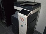a black and white printer sitting on top of a black and white printer