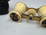 two binoculars sitting next to each other on a table