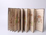 an old book opened to reveal a page with drawings on it