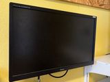 a flat screen tv mounted on a wall in a room