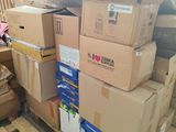 a pile of boxes on a pallet in a warehouse