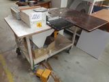 an image of a workbench in a workshop with a lot of tools on it