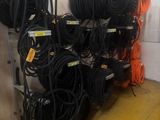 a lot of hoses that are on a rack