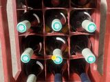 many bottles of wine in a red box