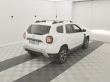 a picture of a white car parked in a garage