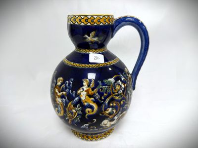 a blue vase with a gold decoration on it
