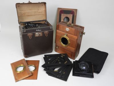 many different types of antique cameras on display