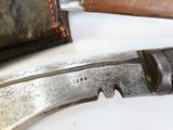 a knife on the table next to a knife holder