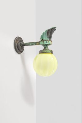 a light that is on the wall next to a door