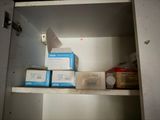 a small cabinet with a lot of boxes on top of it