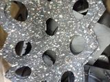 a snowflake made out of silver glitter in a cardboard box