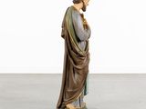 a statue of jesus holding a baby in his arms