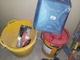 two buckets with tools sitting on the floor next to each other