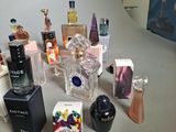 many different perfumes and perfume bottles on the table