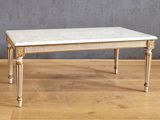 an image of a marble topped coffee table on a hard wood floor