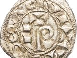 Gros plan sur une pièce de monnaie portant une croix