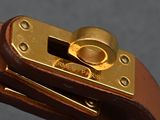 a close up of a brown leather belt with a gold buckle