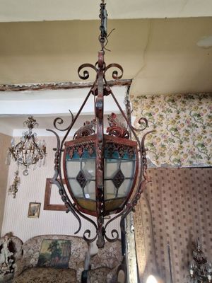 a chandelier hanging from the ceiling in a living room