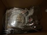 a box full of silverware and other items in it