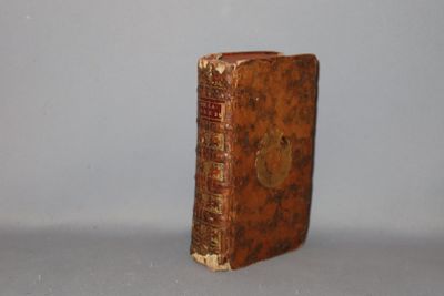 an old book that is sitting on a table