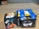 two boxes of food sitting on the floor next to a box of food
