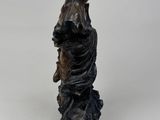 statue of a woman holding a bird on a white background